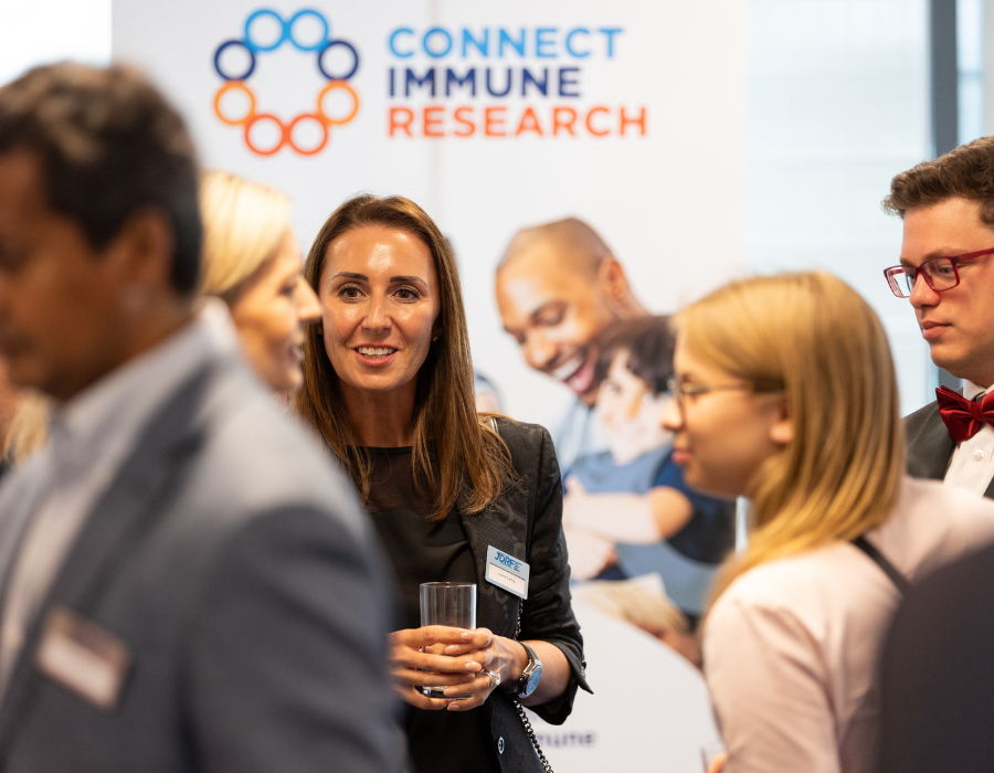 Leanne Carling meeting other invited guests at JDRF research facilities in London for event attended by HRH The Queen